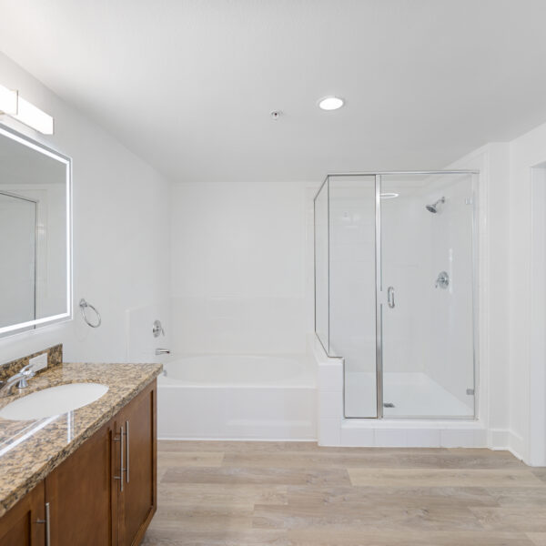 Spacious master bathroom with double sinks, LED lit vanity mirror and bluetooth speaker ventilation fan