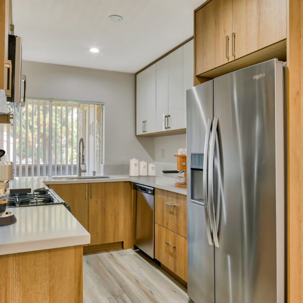 Kitchen with stainless steel appliances, quartz countertops and new modern cabinetry and fixtures
